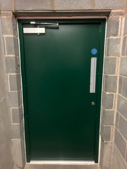 Demon Magnelis steel door installed at Edgbaston car park replacing old timber door