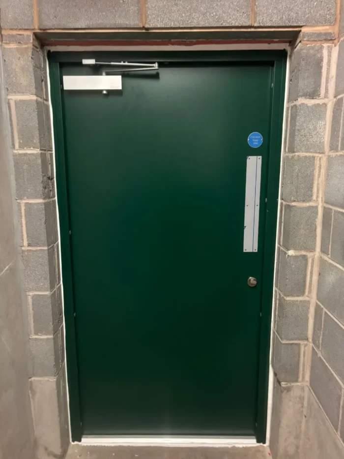 Demon Magnelis steel door installed at Edgbaston car park replacing old timber door